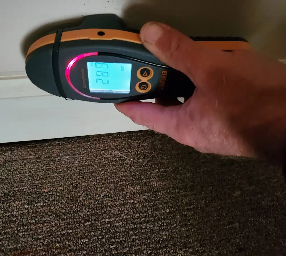 Moisture detection at baseboard during Storm Damage Restoration in Ocoee